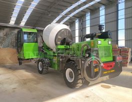 How is the concrete self-loading mixer weighed?